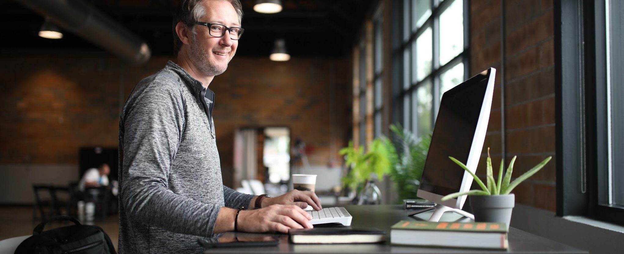 Business man stood at desk